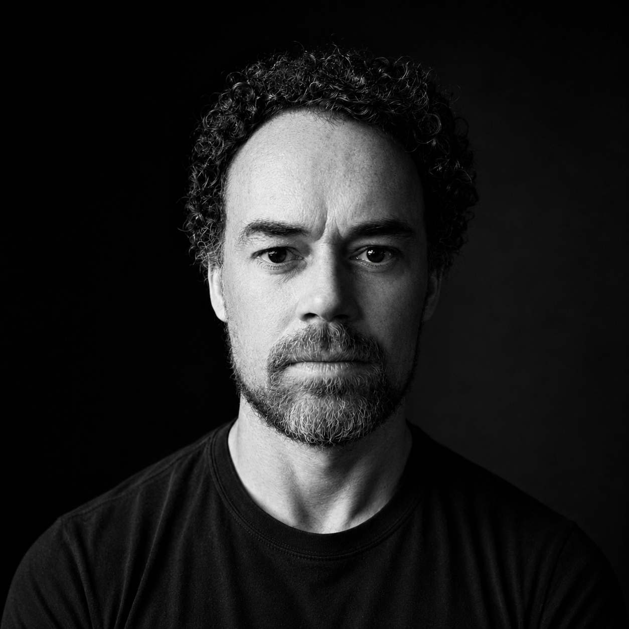 Black and white headshot of James Macpherson